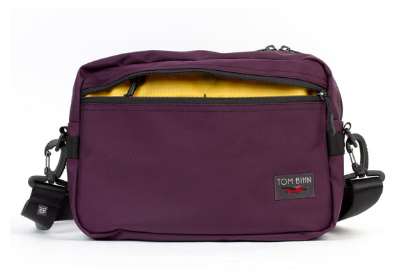 The Side Hustle in Aubergine Ballistic with Marigold 210 Cerylon interior.